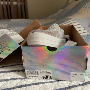 Skechers sneakers silver and white.  Perfect for wedding. NEVER WORN